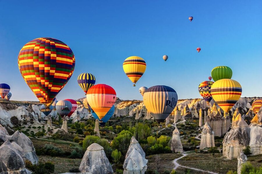 Hot air balloons over the fairy chimneys of Göreme at sunrise