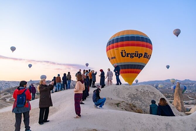 Cappadocia Sunrise Hot Air Balloon Watching Tour w/Transfer - First viewpoint in the hills: balloons rising like clockwork
