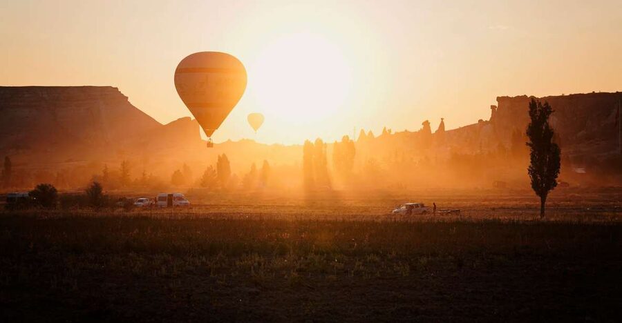 Hot air balloons in Goreme red valley - Why the Göreme Red Valley Balloon View Hits Different