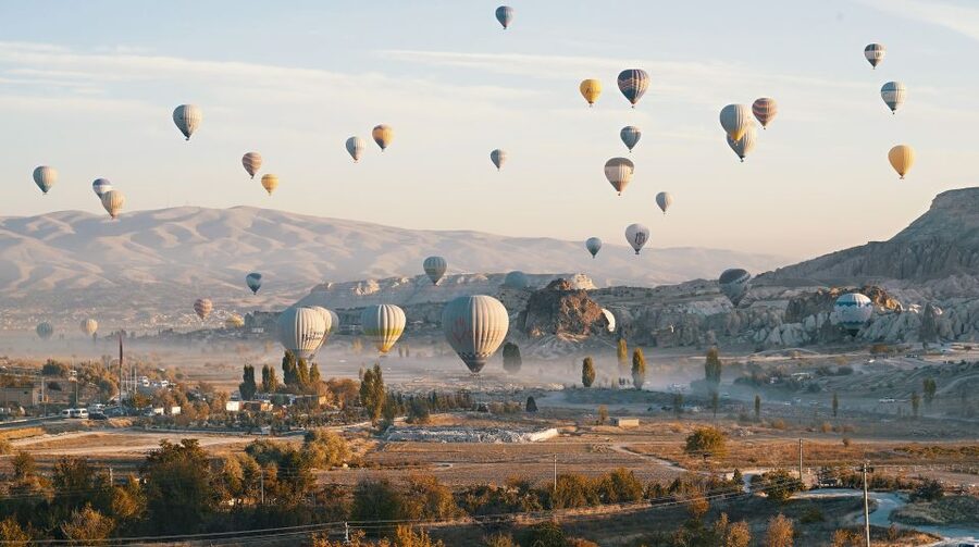 Hot air balloons in Goreme red valley - Who This Balloon Ride Is Perfect For (and Who Should Skip It)